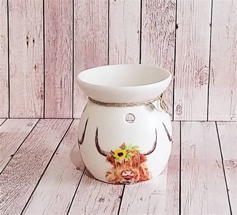 Get Moooving with Our Chic Cow Print Wax Warmer